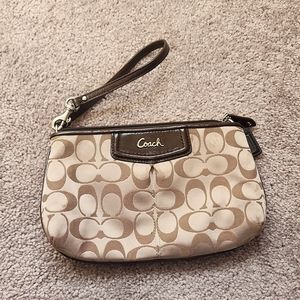 Medium sized brown coach clutch